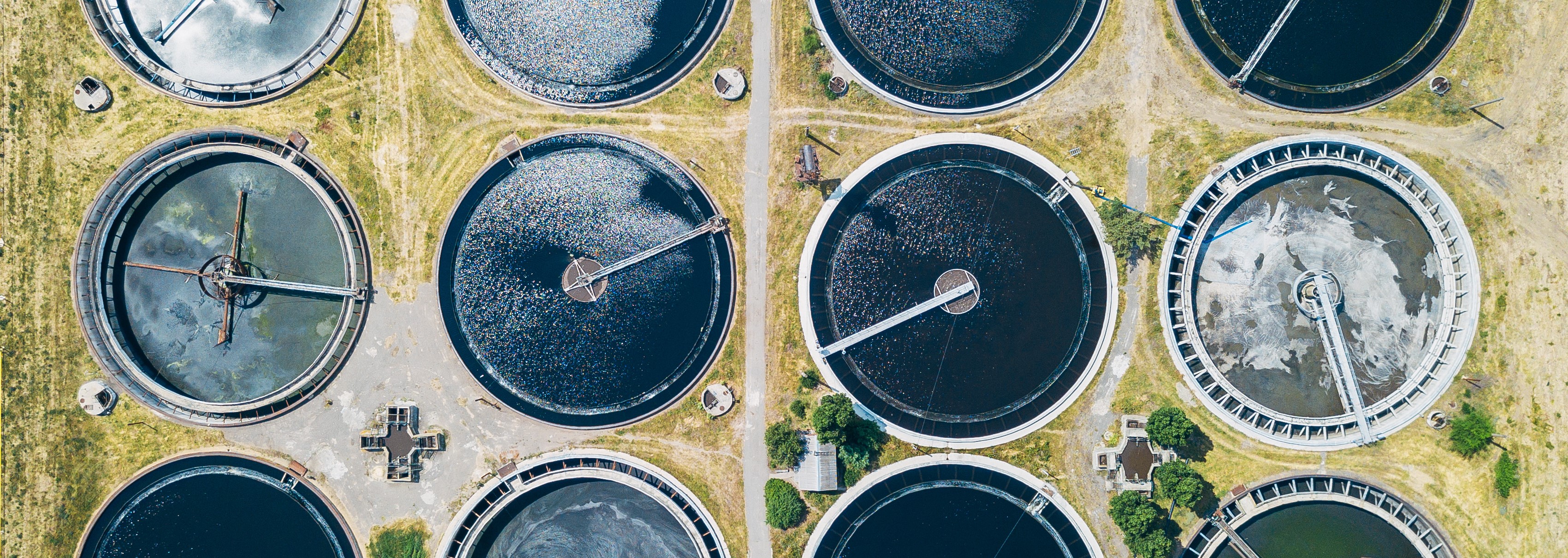 Overhead view of circular tanks at a wastewater treatment plant